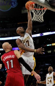 Lamar Odom slams home two against Heat.