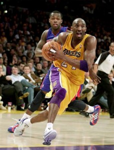 Kobe Bryant drives to basket against Pistons.