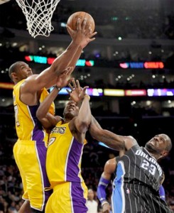 Andrew Bynum grabs one of his game-high 18 rebounds.