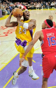 Kobe Bryant drives hard to basket against Clippers.