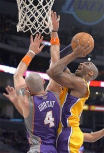 Kobe Bryant fights to get shot up against Phoenix.